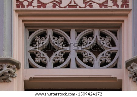 Elements of architectural decorations of buildings, gypsum stucco, plaster ornaments and patterns, wall texture. On the streets in Barcelona, public places.