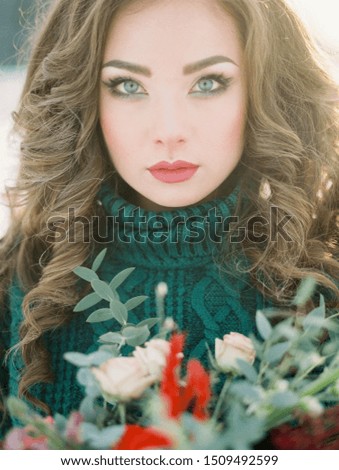 Woman winter portrait in snow forest. Film analog photography.