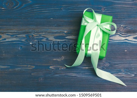Beautiful wrapped gifts on dark wooden background