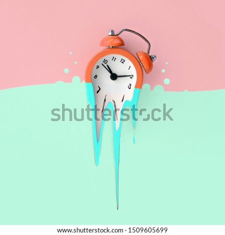 Time is running out concept shows alarm clock that is dissolving down by melting in pastel blue liquid substance . Surreal style image