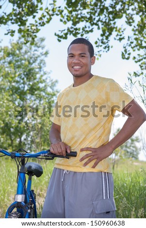 Smiling Healthy Looking Young African American Biking Outdoor