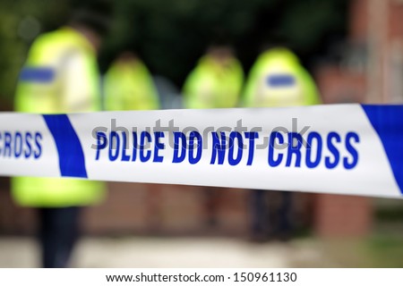 Crime scene investigation police do not cross boundary tape investigating police team Royalty-Free Stock Photo #150961130