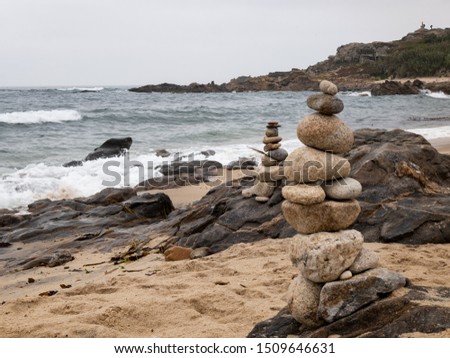 piles of stones along the ocean coast