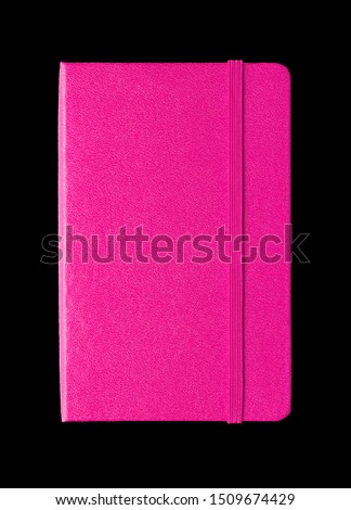 Magenta pink closed notebook mockup isolated on black