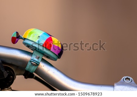 Beautiful and colorful bike bell with green red yellow and pink is important for safety and security in road traffic and a healthy and emission free way of transportation