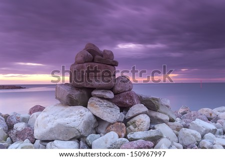 Piling of rocks, baltic ocean in the background