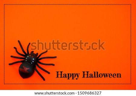 Happy Halloween background with spider on orange background