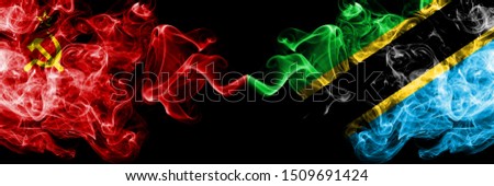 Communist vs Tanzania, Tanzanian abstract smoky mystic flags placed side by side. Thick colored silky smoke flags of Communism and Tanzania, Tanzanian