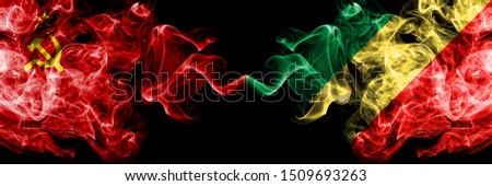 Communist vs Congo, Congolese abstract smoky mystic flags placed side by side. Thick colored silky smoke flags of Communism and Congo, Congolese