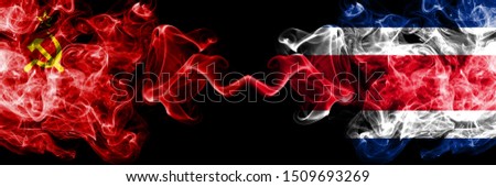 Communist vs Costa Rica abstract smoky mystic flags placed side by side. Thick colored silky smoke flags of Communism and Costa Rica