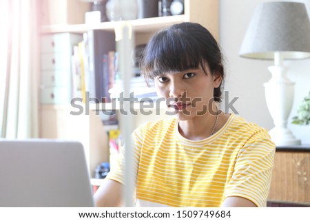 The Asian woman working in home studio.