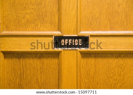 An office door with sign, entrance to business.