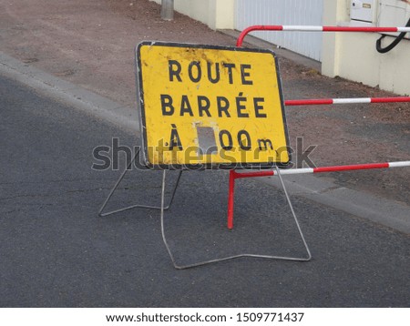 Road block sign due to maintenance work on French villages main street. 
