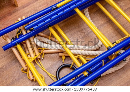 Disassembled home gymnastic wall bars on the floor. Sport gym home concept