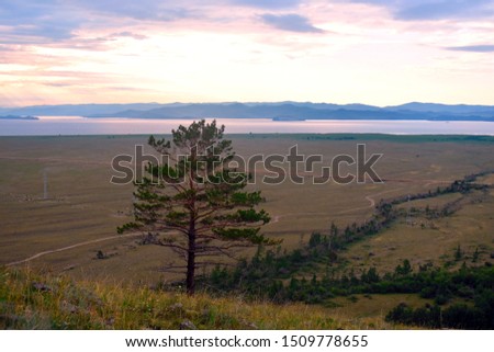 Natural colorful landscape of Russia. Panorama of the nature of Siberia. Scenic views of the mountains and the lake.