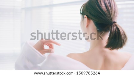 back view of young woman take off bathrobe in the bath room Royalty-Free Stock Photo #1509785264