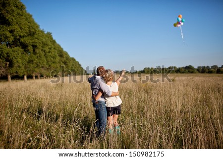 An image of a happy couple in the field