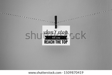 A white Paper hang on clip, motivational and inspirational quotes