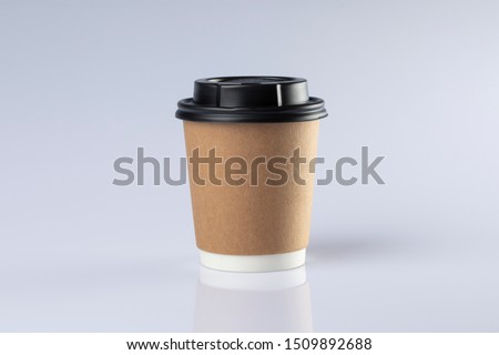 Cardboard coffee cup with lids.  Royalty-Free Stock Photo #1509892688
