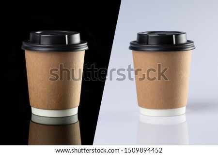 Cardboard coffee cup with lids. Black and white background. Royalty-Free Stock Photo #1509894452