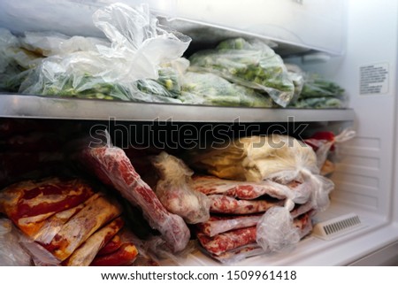 Frozen meat and vegetables in the deep freeze Royalty-Free Stock Photo #1509961418