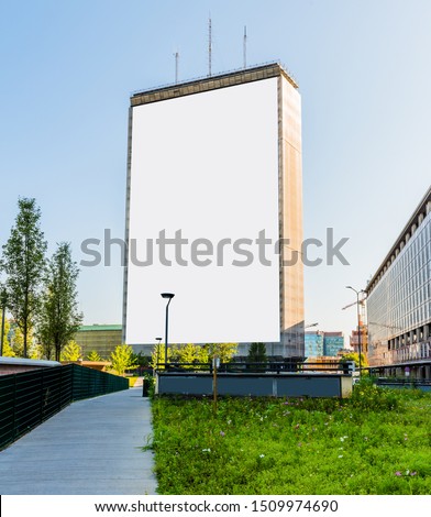 Large blank billboard on building for outdoor advertising in Milano, Italy.

