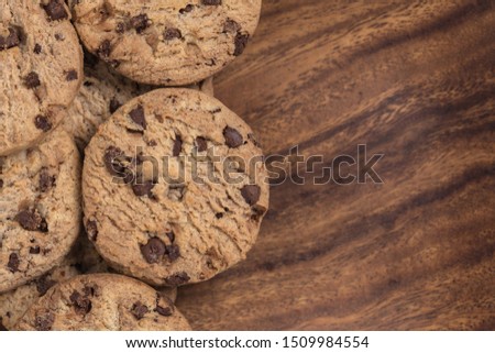 Chock chip cookie on wooden background with copy space. Top view. Flat lay