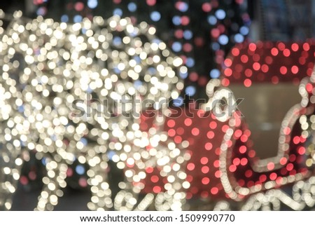 Blurred image of colored lights with bokeh, vintage colors. Colorful beautiful multi-colored lights. Defocused abstract lights christmas background