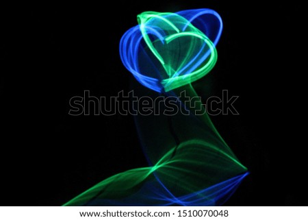 long exposure blue and green glow stick heart image