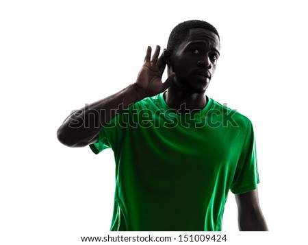 one african man soccer player green jersey hearing gesture  in silhouette  on white background