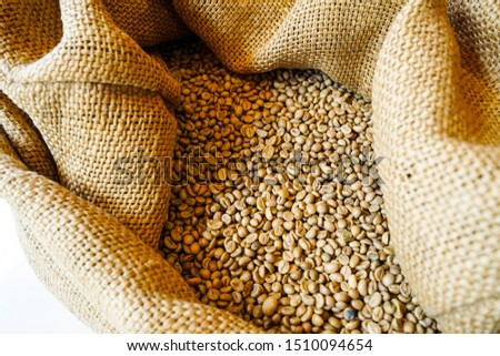Roasted coffee beans in a brown sack bag Stock photo
