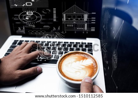Designer Businessman hand using smart phone with laptop computer and a cup of coffee in modern office on dark table and a virtual interface icons screen, Concept of big data. Double exposure.