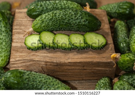 Sliced round slices cucumber on a wooden table. Organic food. Agricultural retailer. Farm food.
