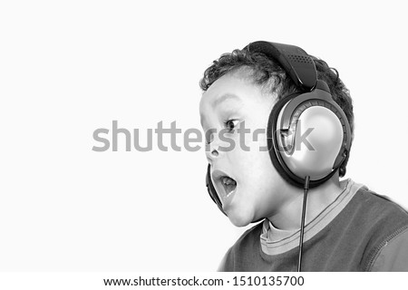 little boy with headphones enjoying music on white background with people stock photography stock photo