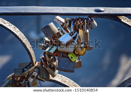 The lock of love: padlocks on bridges. Love locks, padlocks locked to the bridge