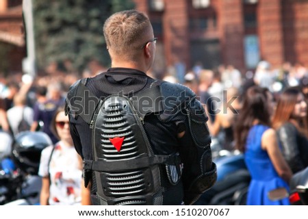 man in biker clothes on a biker party, parade of motorcyles