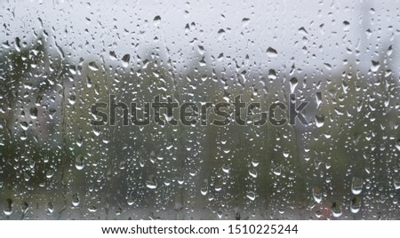 Rain drops on window , september rainy day 