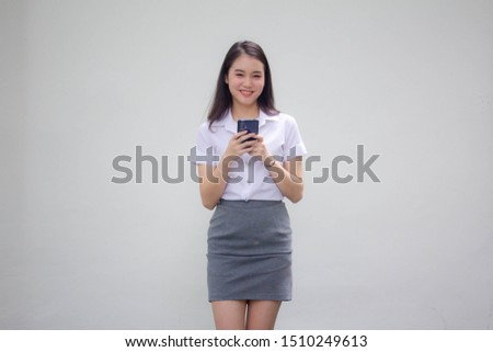 Portrait of thai adult working women white shirt using smart phone