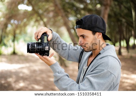 casual photographer shooting pictures and video edit