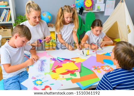 Preschool Teacher with Children at Kindergarten - Creative Art Class Royalty-Free Stock Photo #1510361192