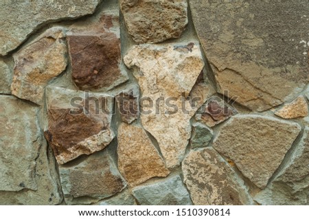 A view of texture stone wall with seams between the stones