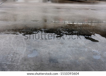 wet road on parking in city