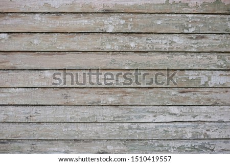 Wood texture surface as background. Painted planks and cracks. Pastel tones.