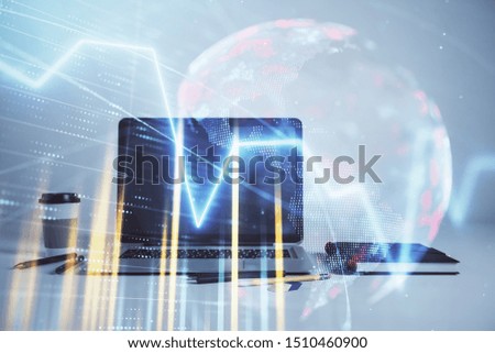 Stock market chart with globe hologram and desktop office computer background. Multi exposure. Concept of financial analysis.