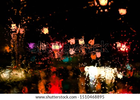 Rain causes raindrops. Is water droplets that reflect on the light in the car glass Resulting in beautiful abstract backgrounds And with cool, fresh air from nature.