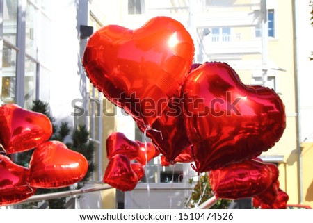 Red shiny balloons in heart shape. Wedding decoration.