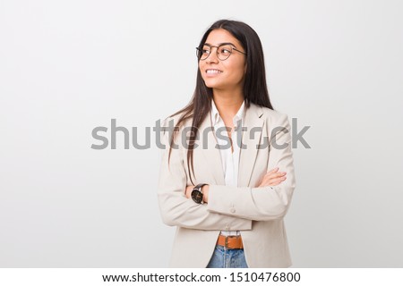 Young business arab woman isolated against a white background smiling confident with crossed arms. Royalty-Free Stock Photo #1510476800