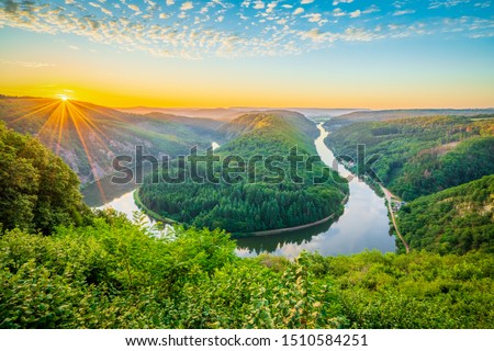 Beautiful sunrise view of Saar river near Saarschleife at Clief near Mettlach. South Germany  Royalty-Free Stock Photo #1510584251
