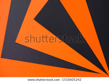 Halloween conten parties and decorations. Black-orange background and gingerbread cookies. Decor