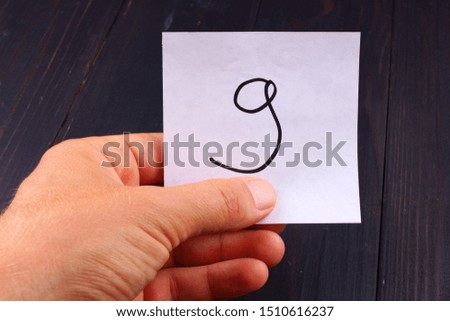 Nine figure on paper in hand